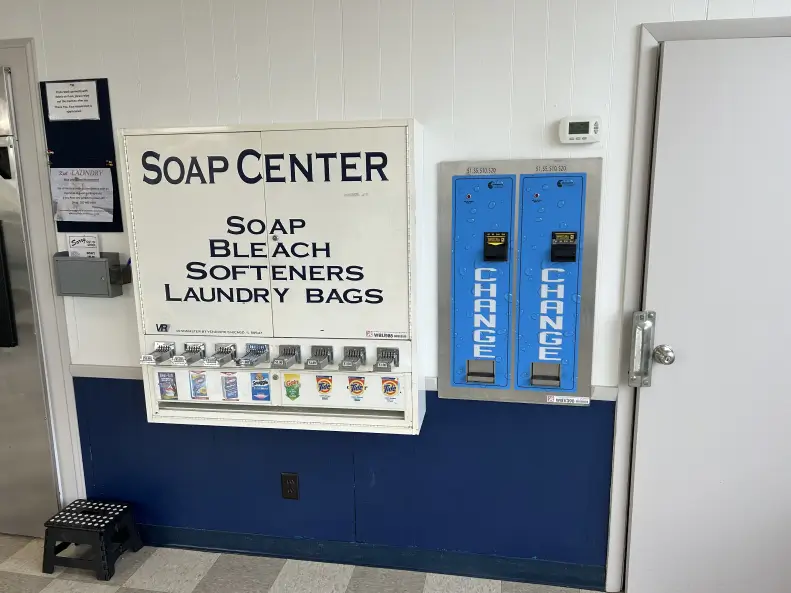 Kiel Washbasket Laundromat view of soap dispensers and change machines.