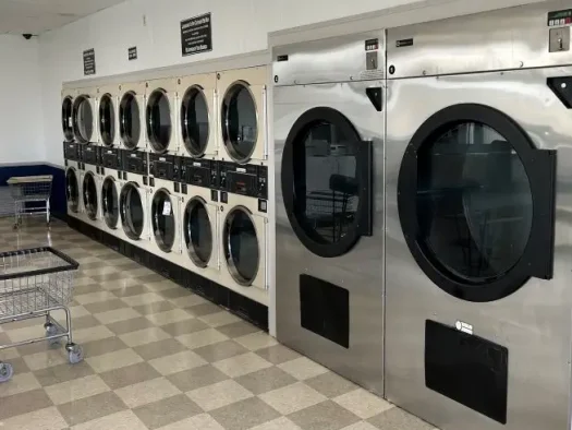 Kiel Washbasket Laundromat interior view of dryers.